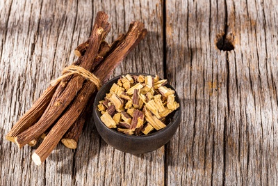 Licorice root extract in skincare products for brightening dark spots and uneven skin tone